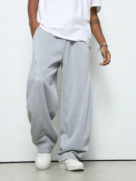Manfinity Hypemode Men'S Young Street Style, Collegiate Sports, INS Matched with High Street Black Ultra-Loose Crescent Moon-Shaped Fashionable Athletic Sweatpants. These Pants Feature a Slogan "RICH SOON" and a Star Pattern with a Puff Print Design. with